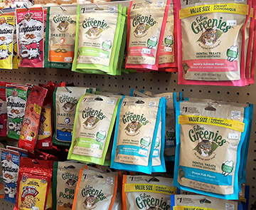 Display of colourful packages of pet treats
